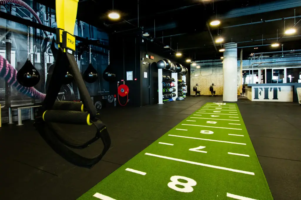 Functional gym interiors with ample storage and practical equipment.