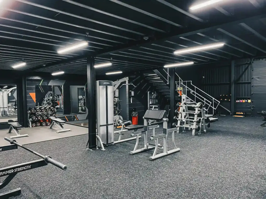 Stylish gym interiors featuring state-of-the-art equipment and lighting.
